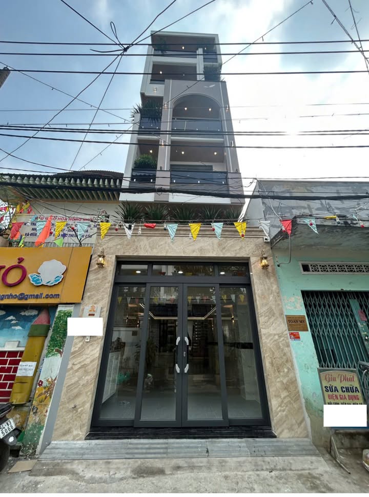 Nhà 6 tầng Gò Vấp 89m² giá 16.7 tỷ - Gara ô tô và phòng karaoke sang trọng!